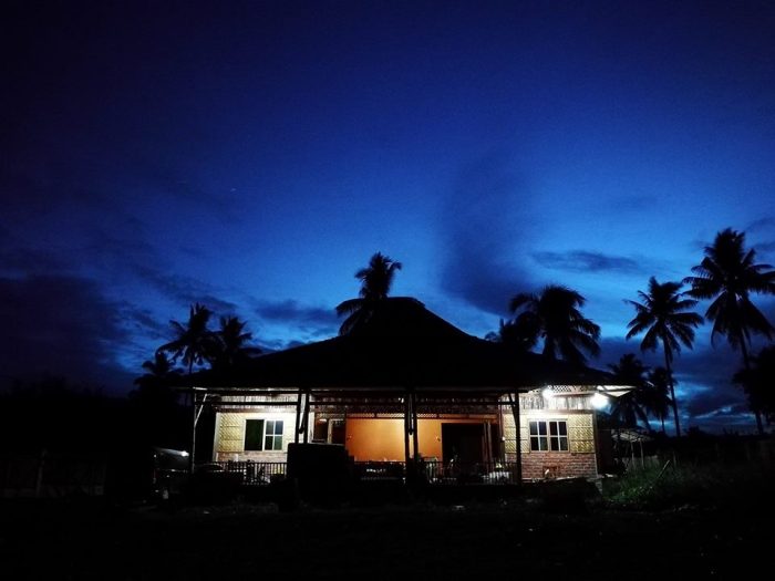 3 Night view of a house made from Bamboo with Okir details.jpg